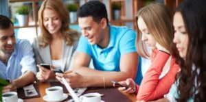 Young 'digital natives' using digital devices in a group