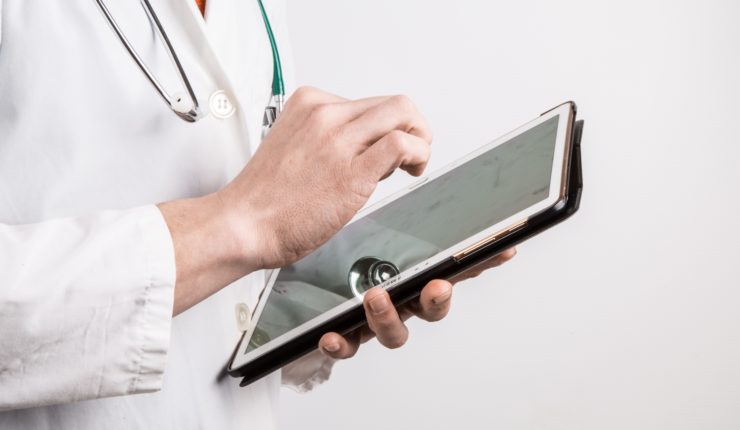 Doctor using tablet