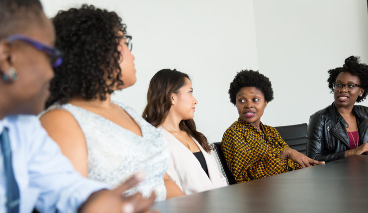5 people in a meeting speaking around a table - soft data and feedback as this blog suggests