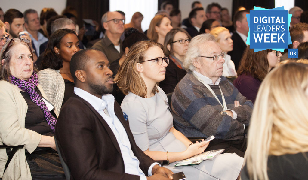 Attendees listening to a speaker