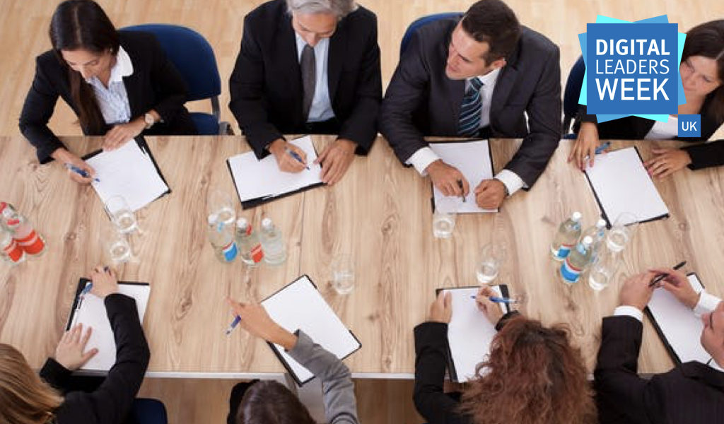 Ariel view of professionals having a discussion around a table