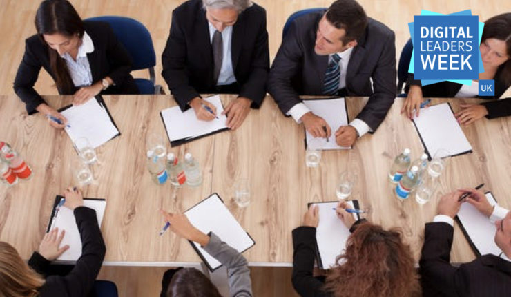 Ariel view of professionals having a discussion around a table