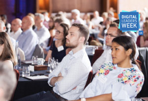 a group of professional people listening to a speaker