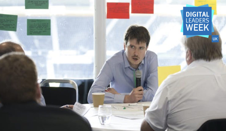 man with microphone facilitating masterclass