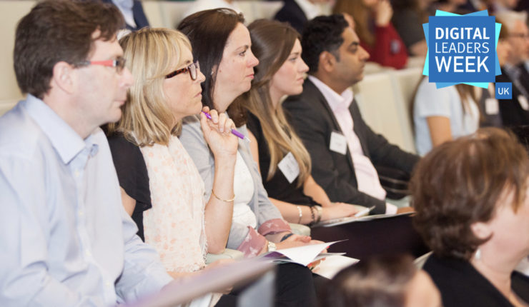 Audience members engrossed in discussion on stage