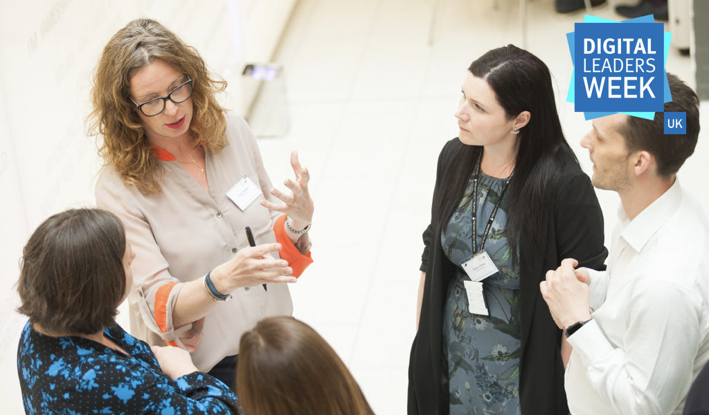 Group of people engaged in a conversation about data in a circle