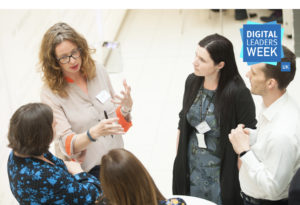 Group of people engaged in a conversation about data in a circle