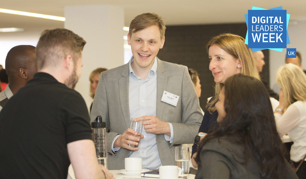 Group of people gathered around a table discussing future skills