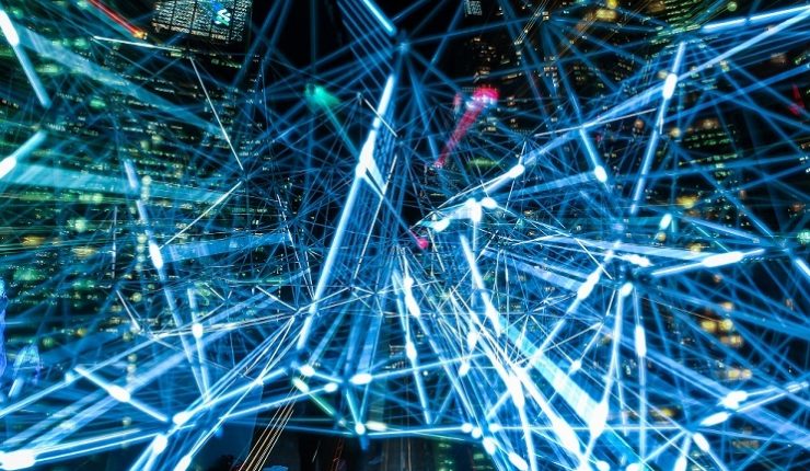 Big Data visualisation through neon tubes by a night cityscape