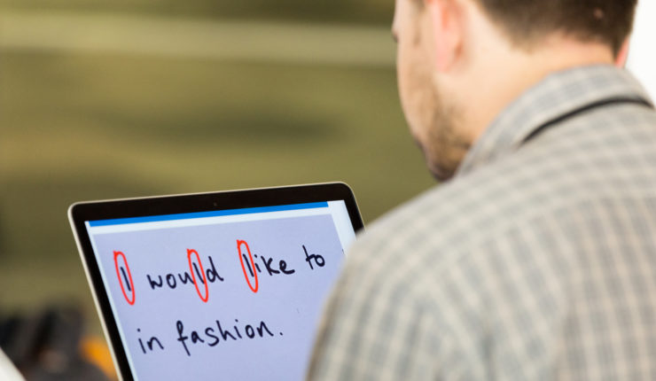 Man using screen accessibility on his laptop, highlighting upper and lower case letters that look the same