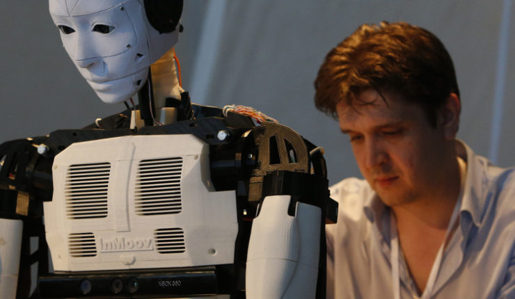 Man working on a robot machine