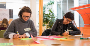 Two service designers working on a new digital service