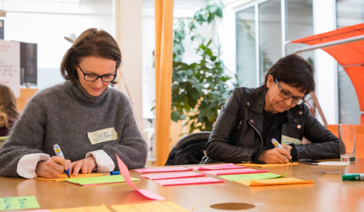 Two service designers working on a new digital service