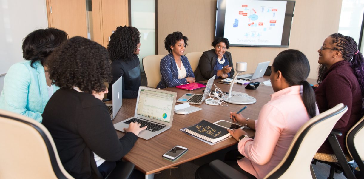 business brainstorming session around a table in an office space