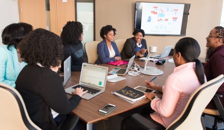 business brainstorming session around a table in an office space
