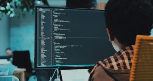 Someone using a computer to edit computer code