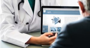 Doctor using a computer to access data for healthcare