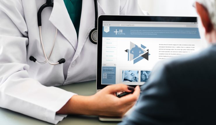 Doctor using a computer to access data for healthcare