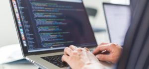 Someone on a laptop using low code