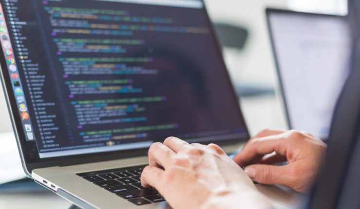 Someone on a laptop using low code