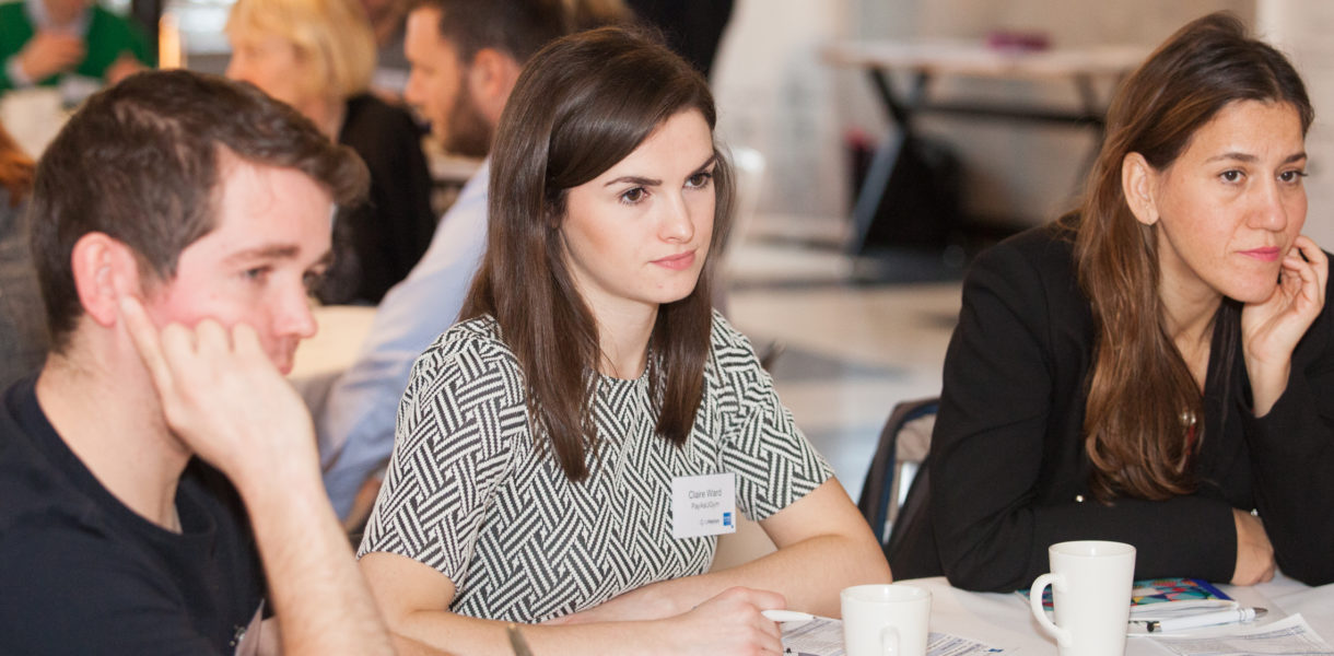 people discussing at a table