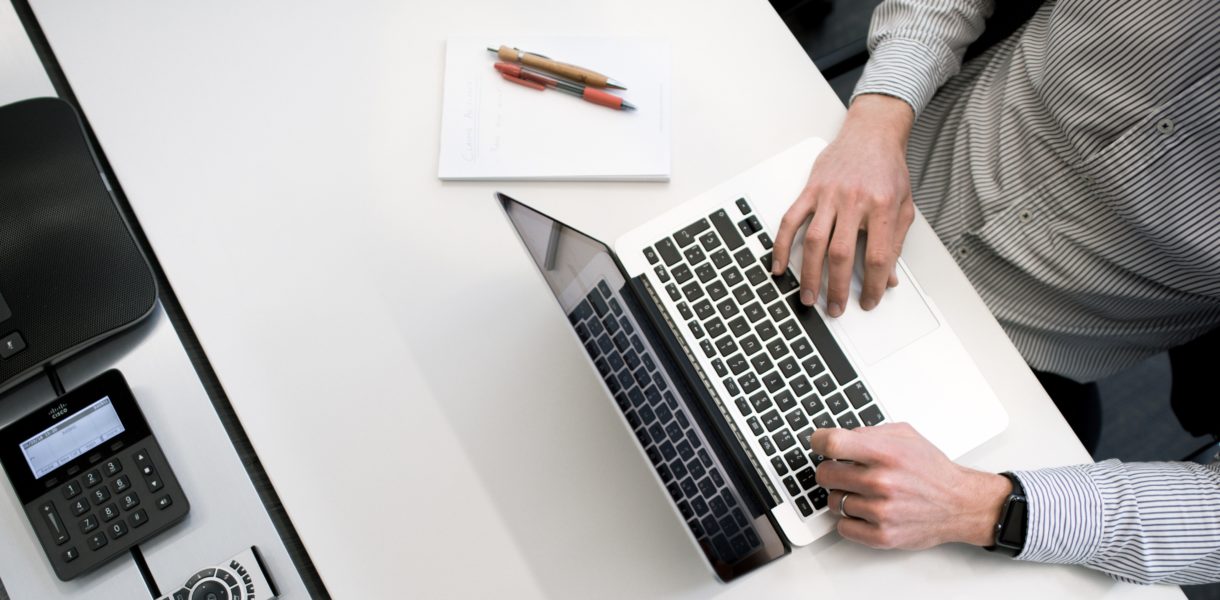 Man typing on a computer