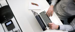 Man typing on a computer