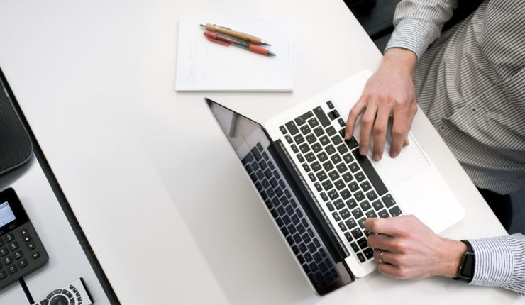 Man typing on a computer