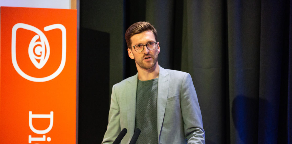 Mark McGinn speaking at event