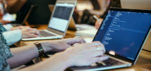 person coding on computer