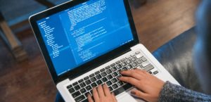 Picture of Hands Typing Code On Laptop