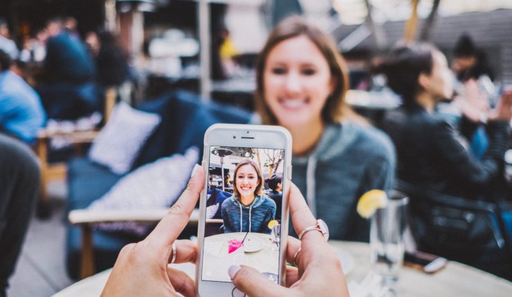 Girl taking a photo for Snapchat
