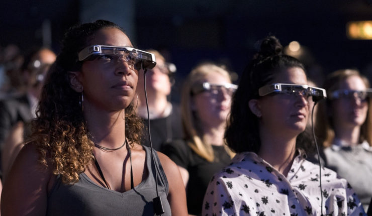 people using smart glasses for the launch of an automated captioning service aimed at the millions of people suffering from hearing loss.