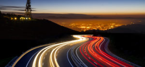 view over highway and city in fast-paced speed