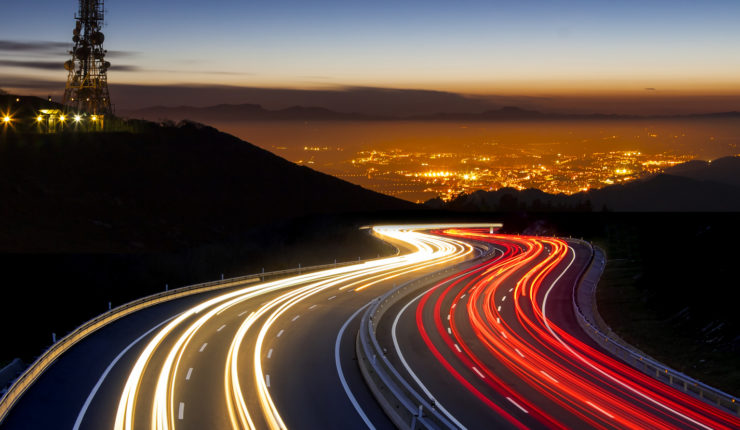 view over highway and city in fast-paced speed