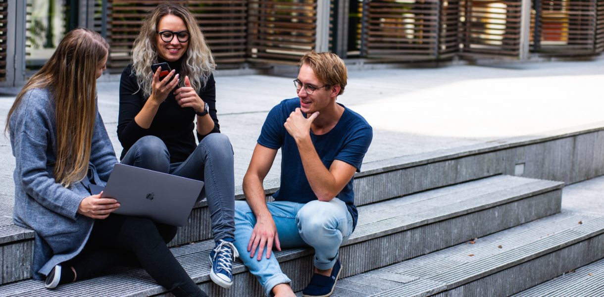 Students sitting on steps discussing
