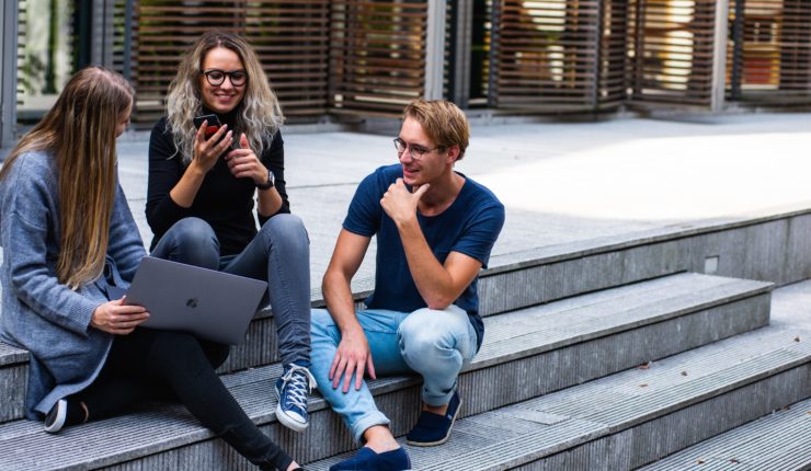 Students sitting on steps discussing