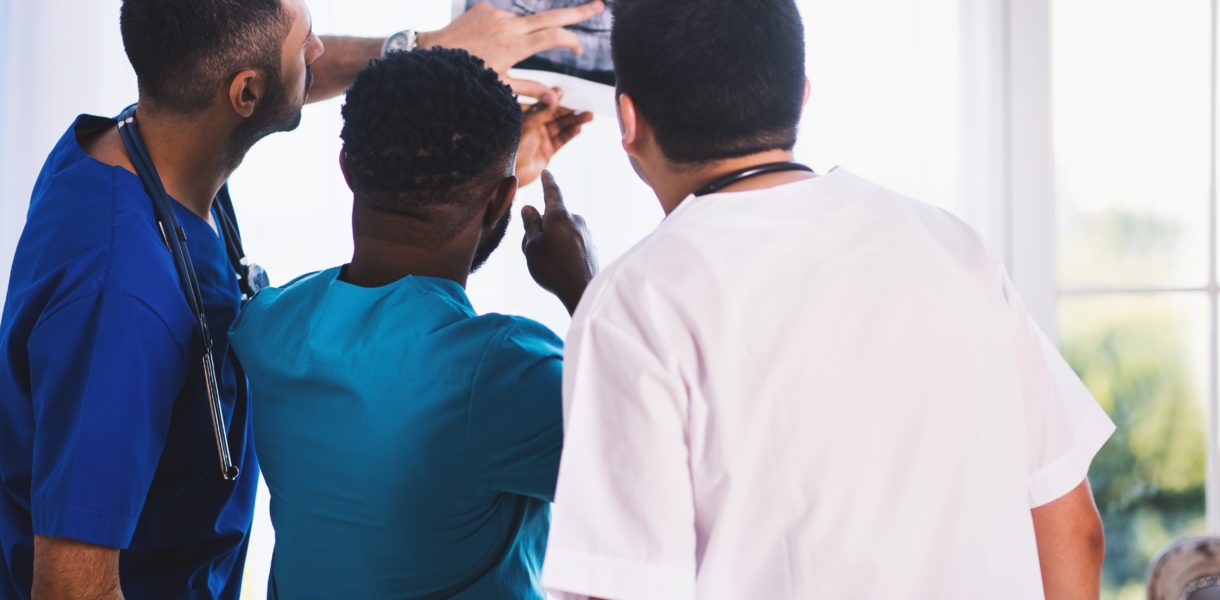 Doctors examining X-ray image
