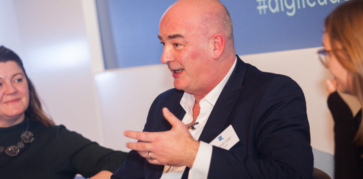 Adrian Leer speaking at conference