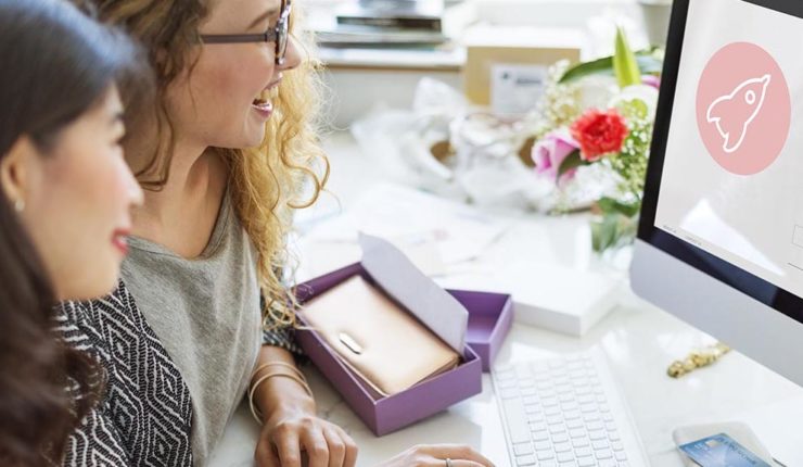 two women working on computer