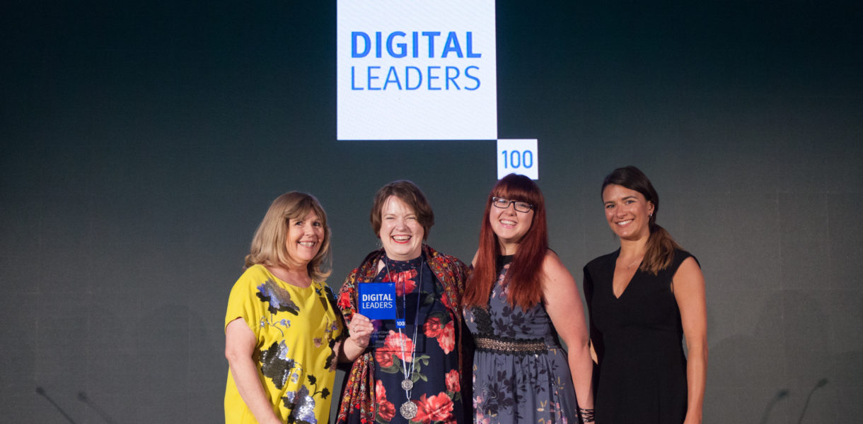 Awards host Maggie Philbin, Catherine Frather of Age UK receiving the award and Eve Joseph of Microsoft presenting