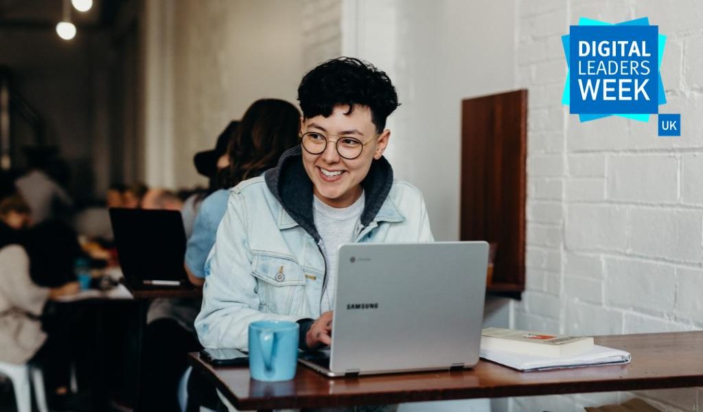 smiling man on laptop