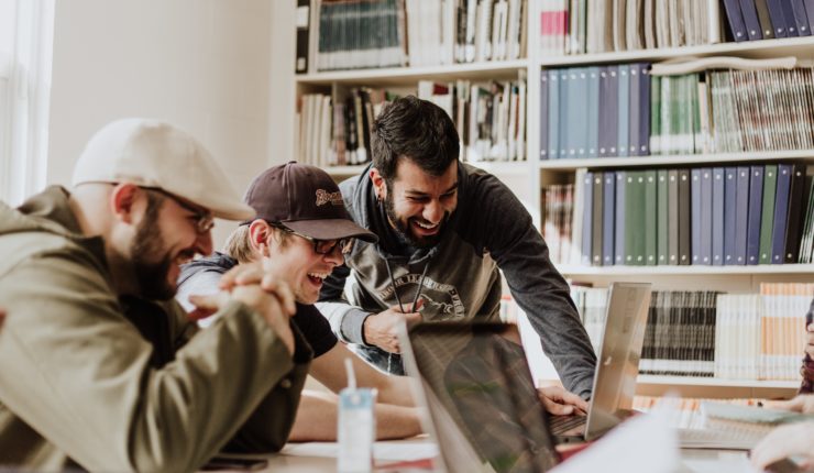 Group of people working together with computers