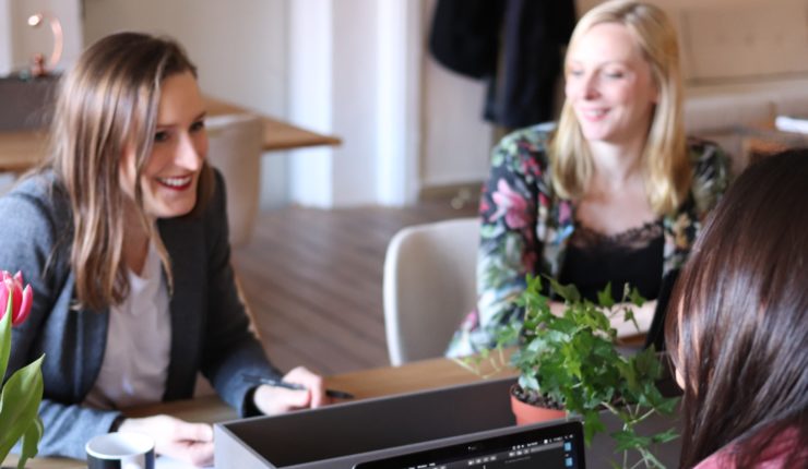 women sitting at desk working