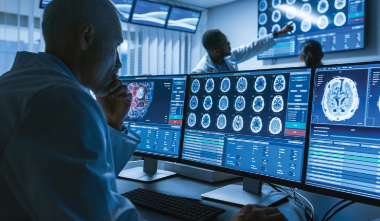 doctor looking a screens