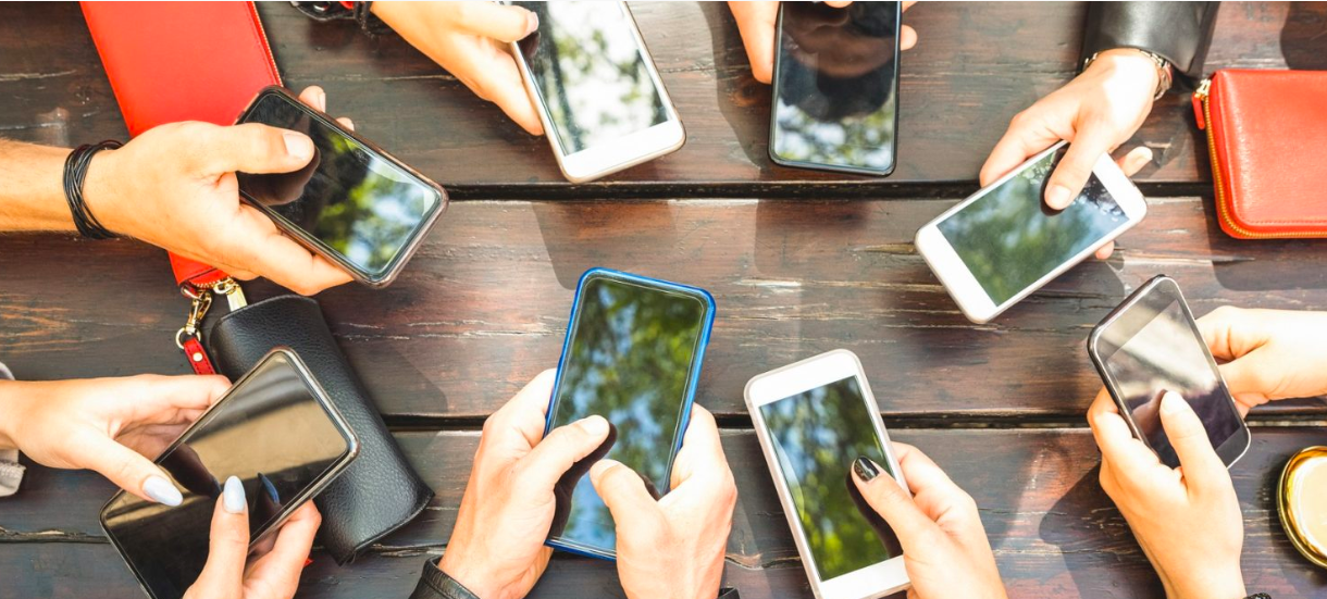 hands holding cell phones