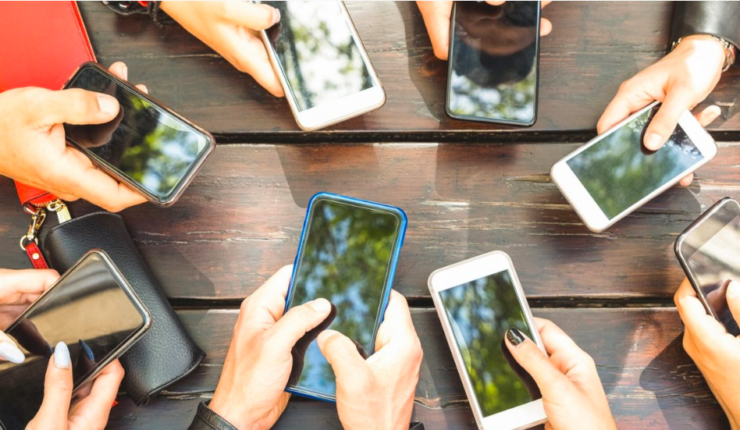 hands holding cell phones