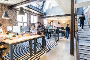 people working in an open office space