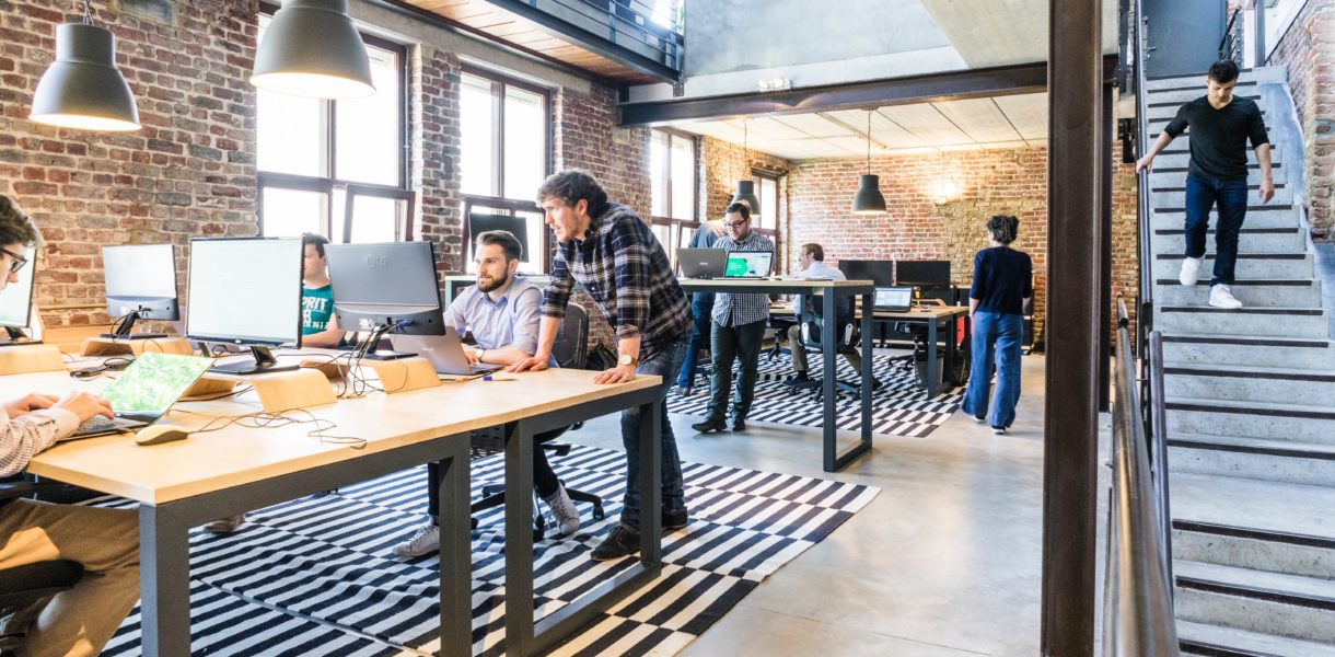 people working in an open office space