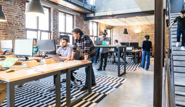 people working in an open office space